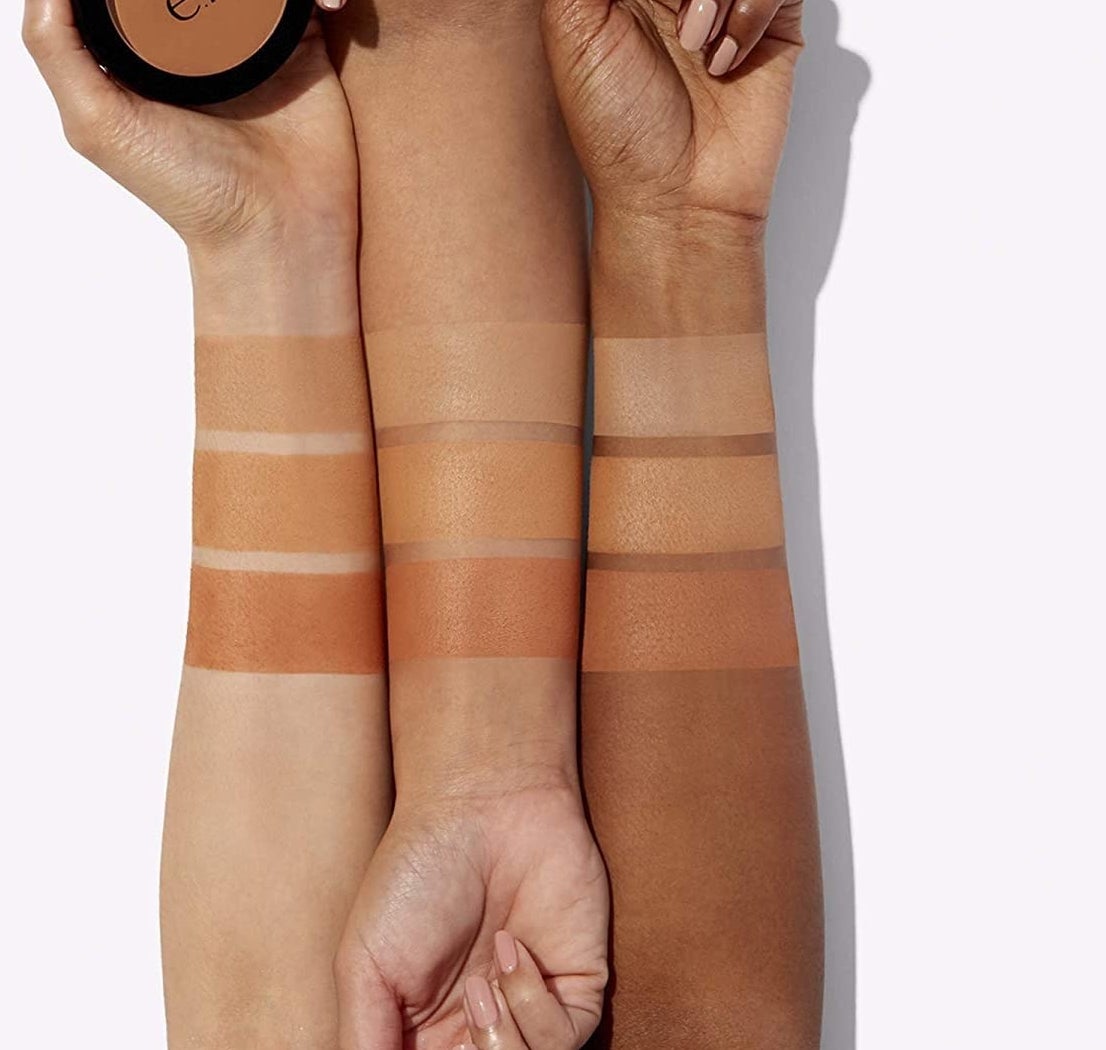 a trio of hands with the bronzer swatched on different skin tones