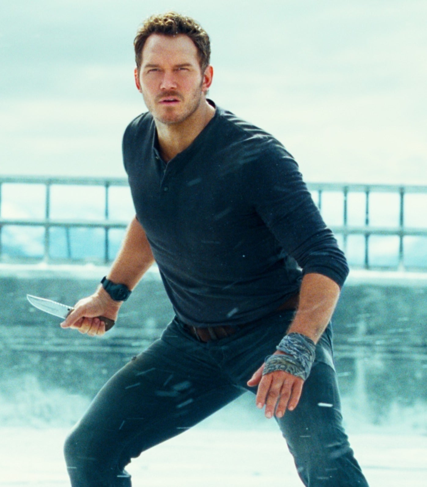 Chris Pratt holding a knife in Jurassic World: Dominion