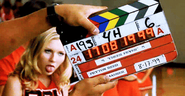 GIF of a Bring It On outtake showing Kirsten Dunst with her tongue hanging out