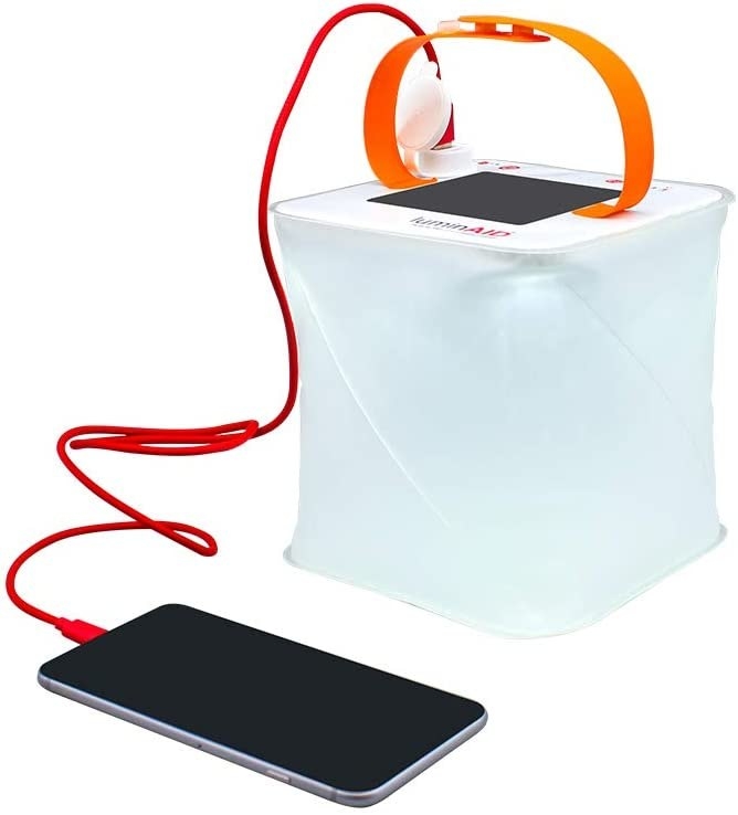 The camping lantern charging a phone