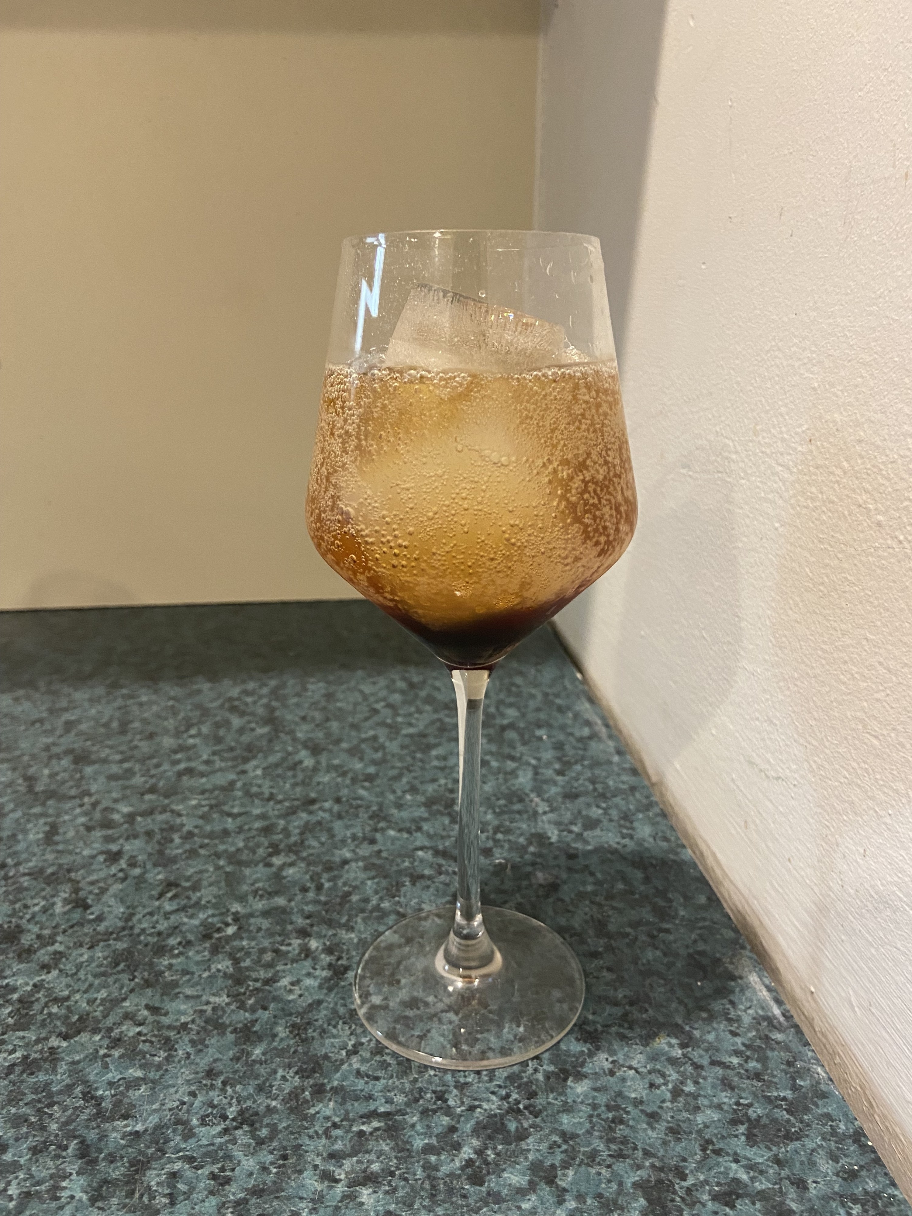 The glass with ice, vinegar, and La Croix