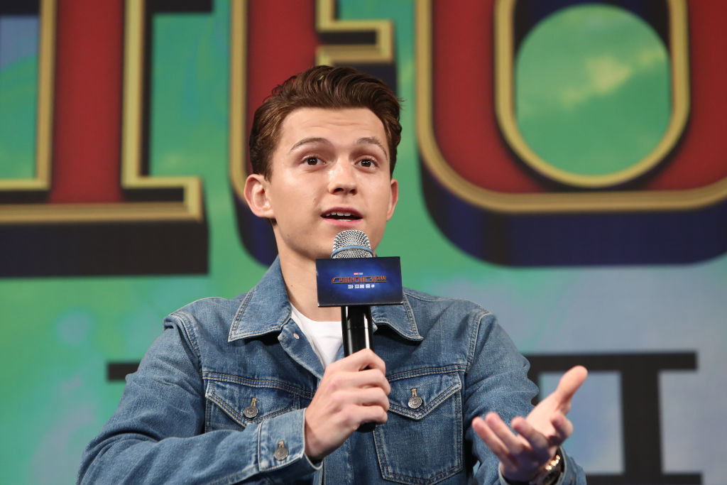Tom Holland talking into a mic