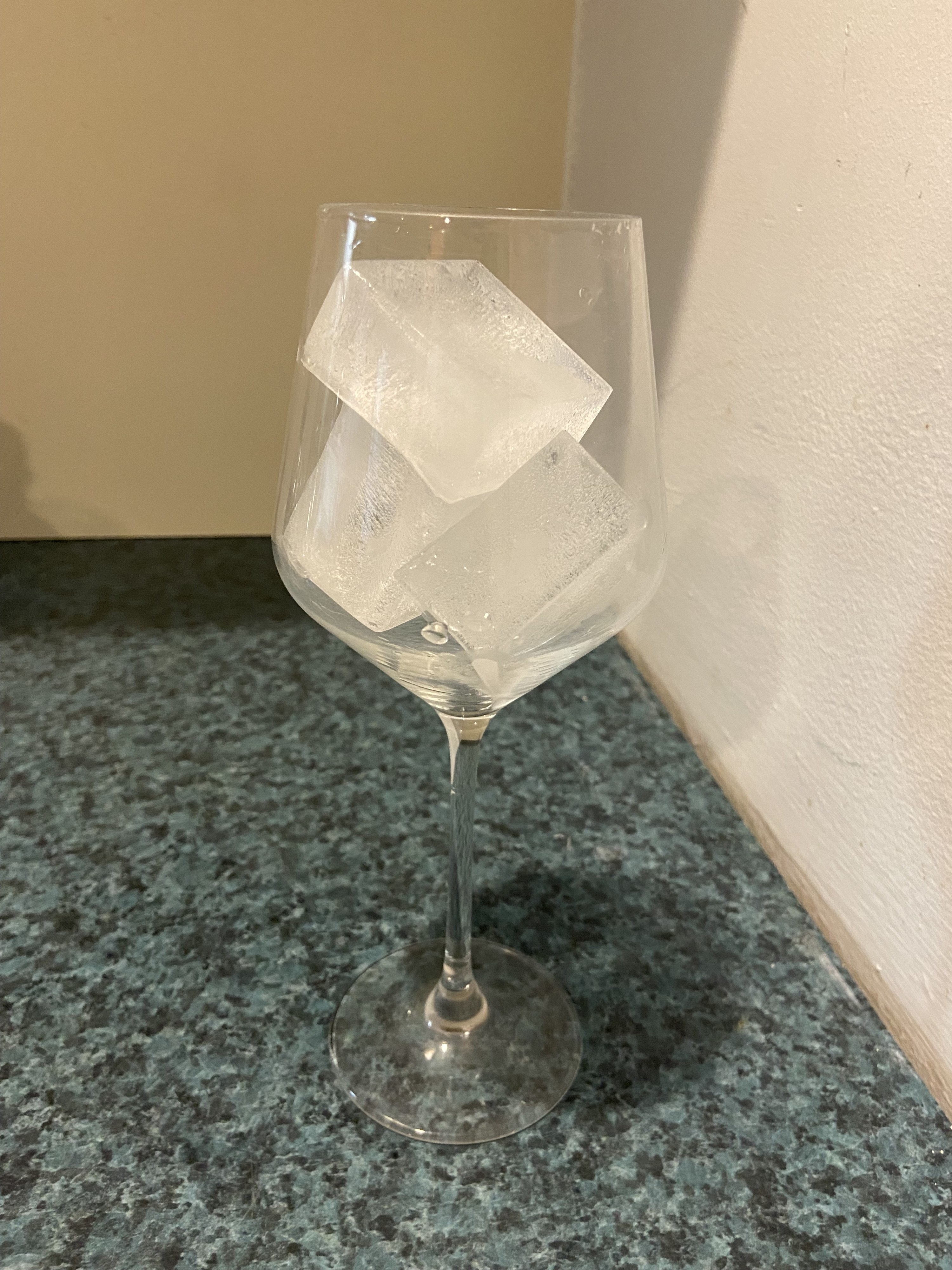 a wine glass filled with ice