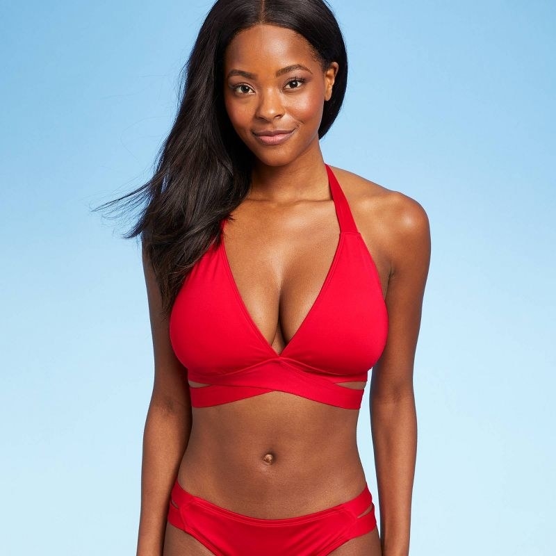 a model wearing the red top