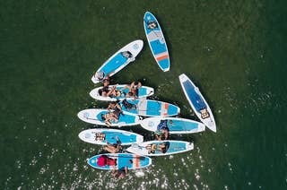 An image of people paddle boarding and kayaking.