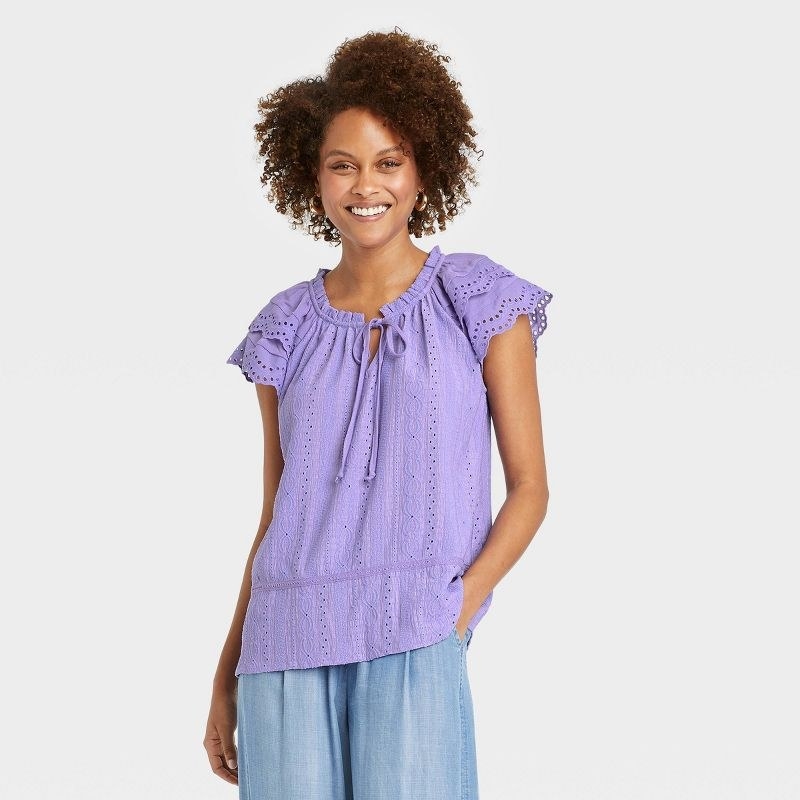 the shirt in purple on a model