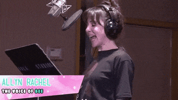 A voice actor recording lines in a voiceover booth