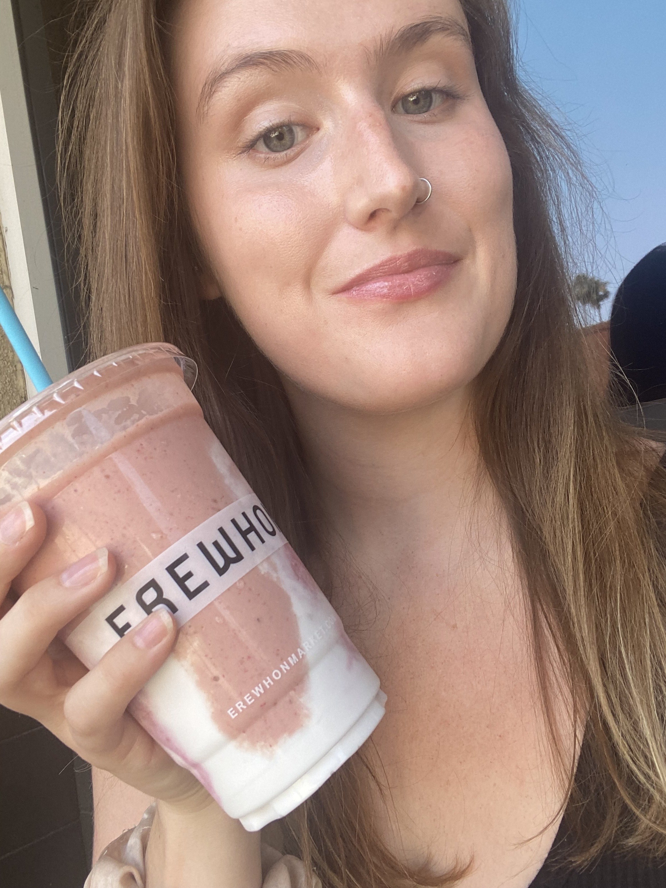 author posing with the drink