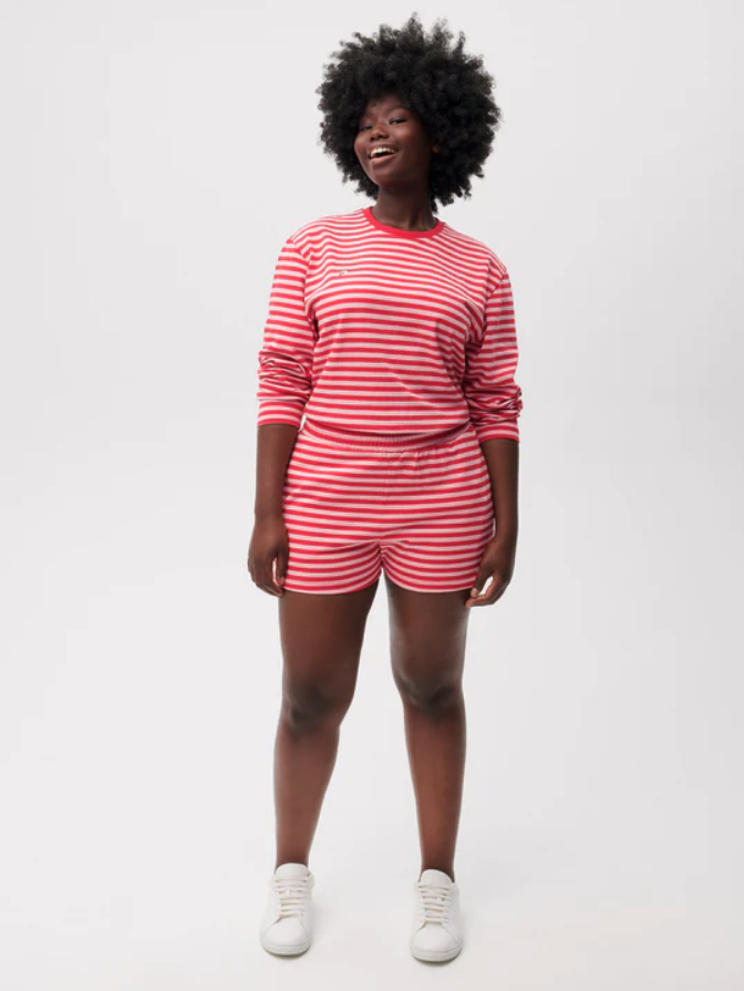 model wearing red striped cotton shorts with matching top