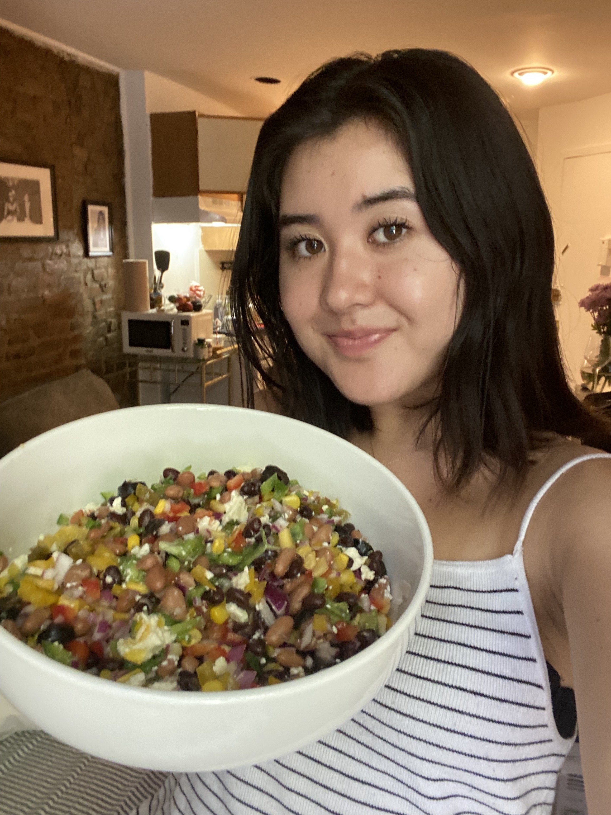 Jen holding a bowl of Cowboy Caviar