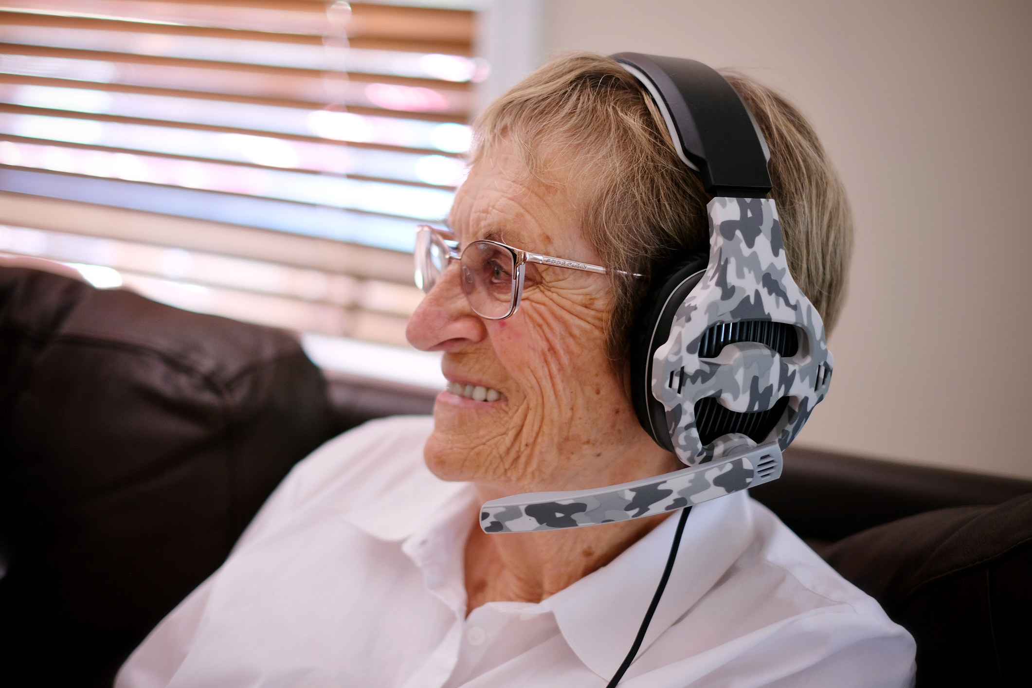 an older person with a gaming headset