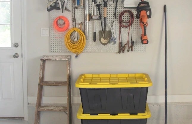 two black and yellow heavy duty storage containers in a garage
