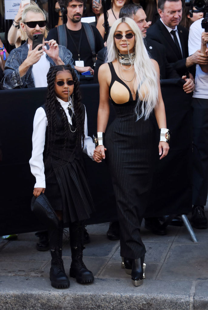 North West and Kim Kardashian holding hands