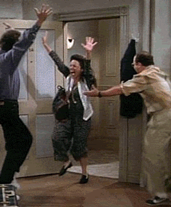 gif of the cast of seinfeld dancing happily
