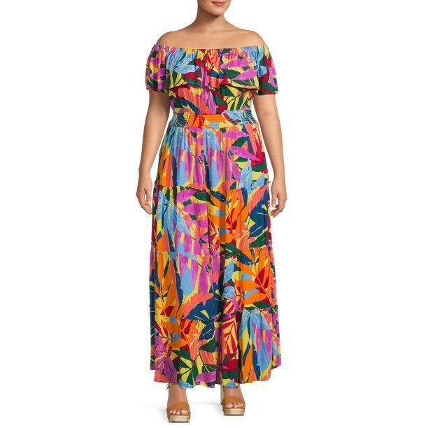 model wearing a colorful off-the-shoulder maxi dress with floral print