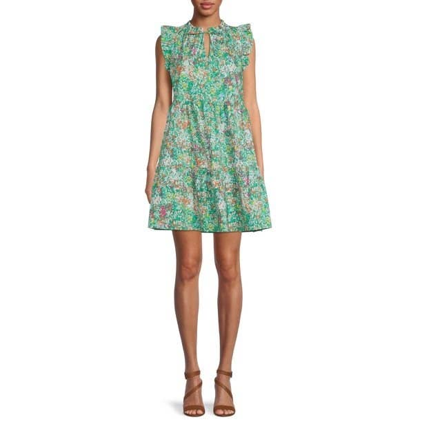 model in a green patterned flutter sleeve short dress
