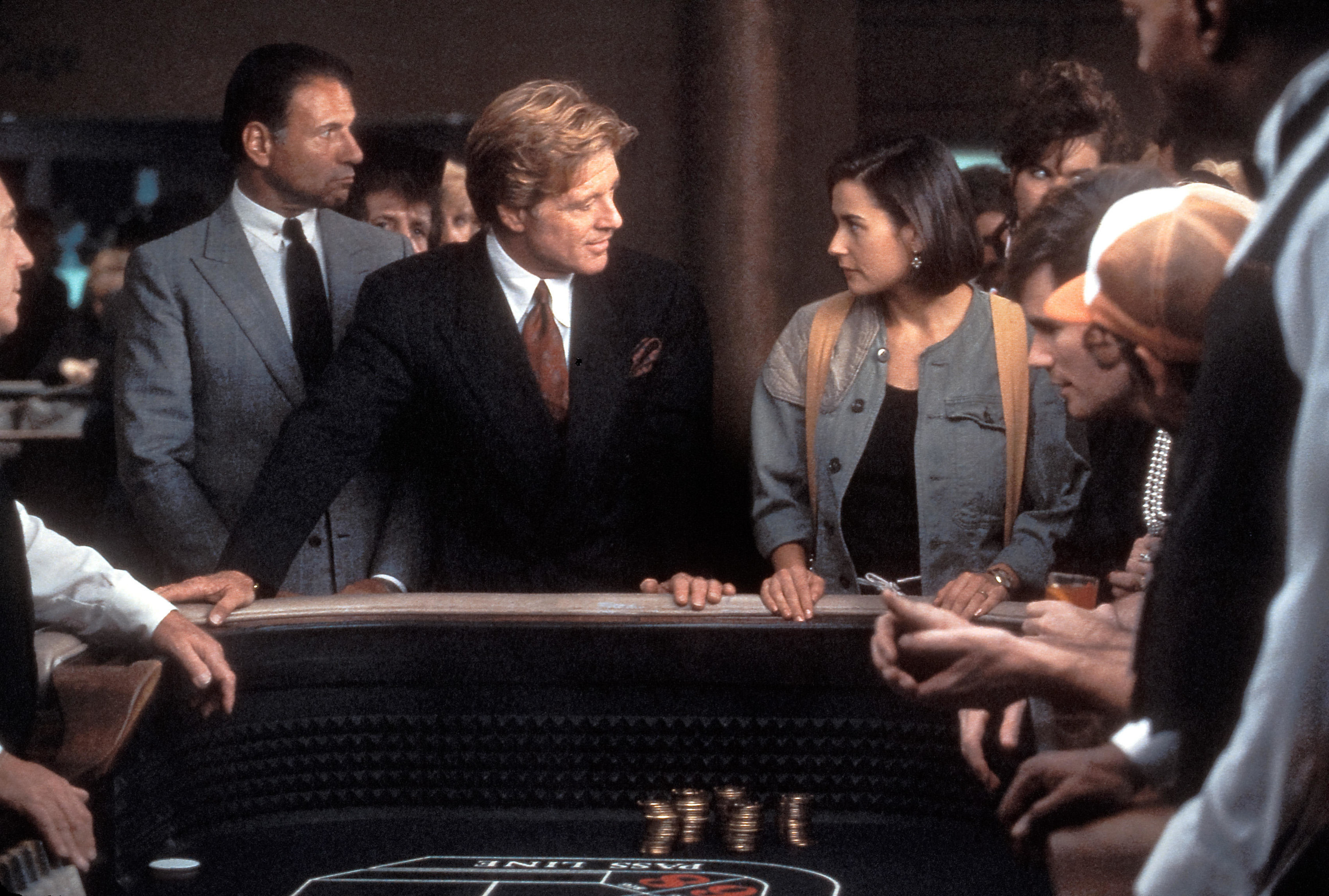 demi moore and robert redford at a craps table in indecent proposal