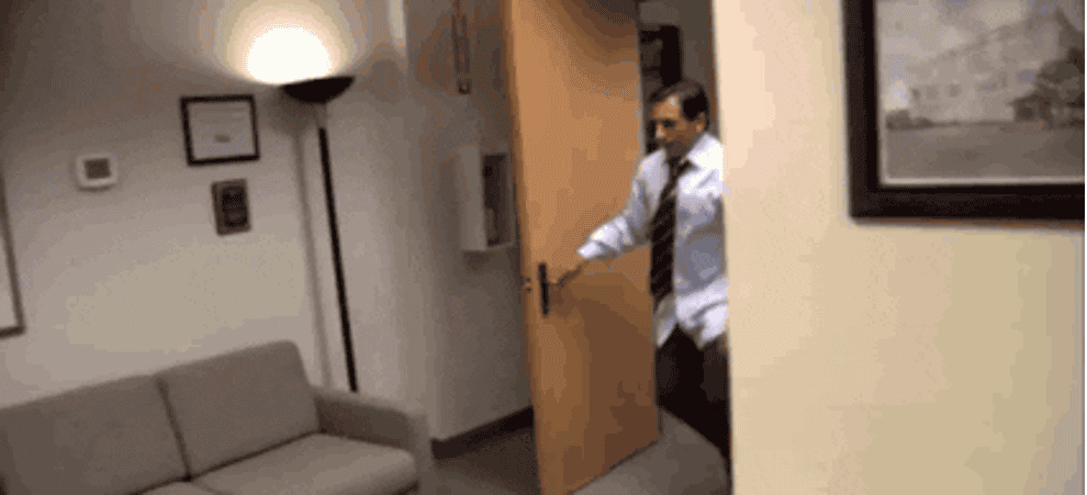 a gif of Michael Scott from the office doing parkour in the office
