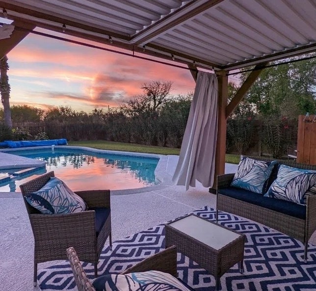 A reviewer&#x27;s brown outdoor patio set at sunset