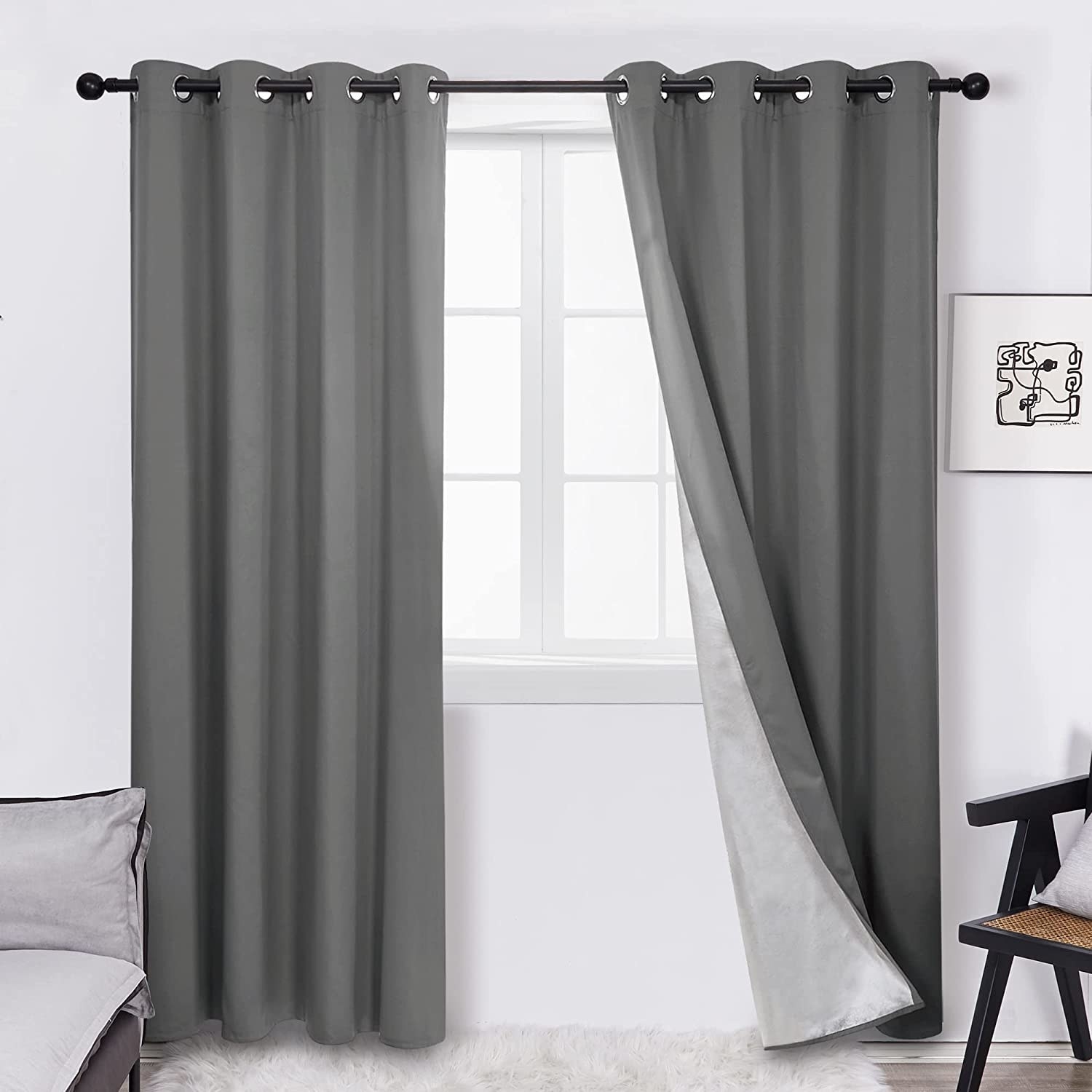 a pair of blackout curtains hung on a window