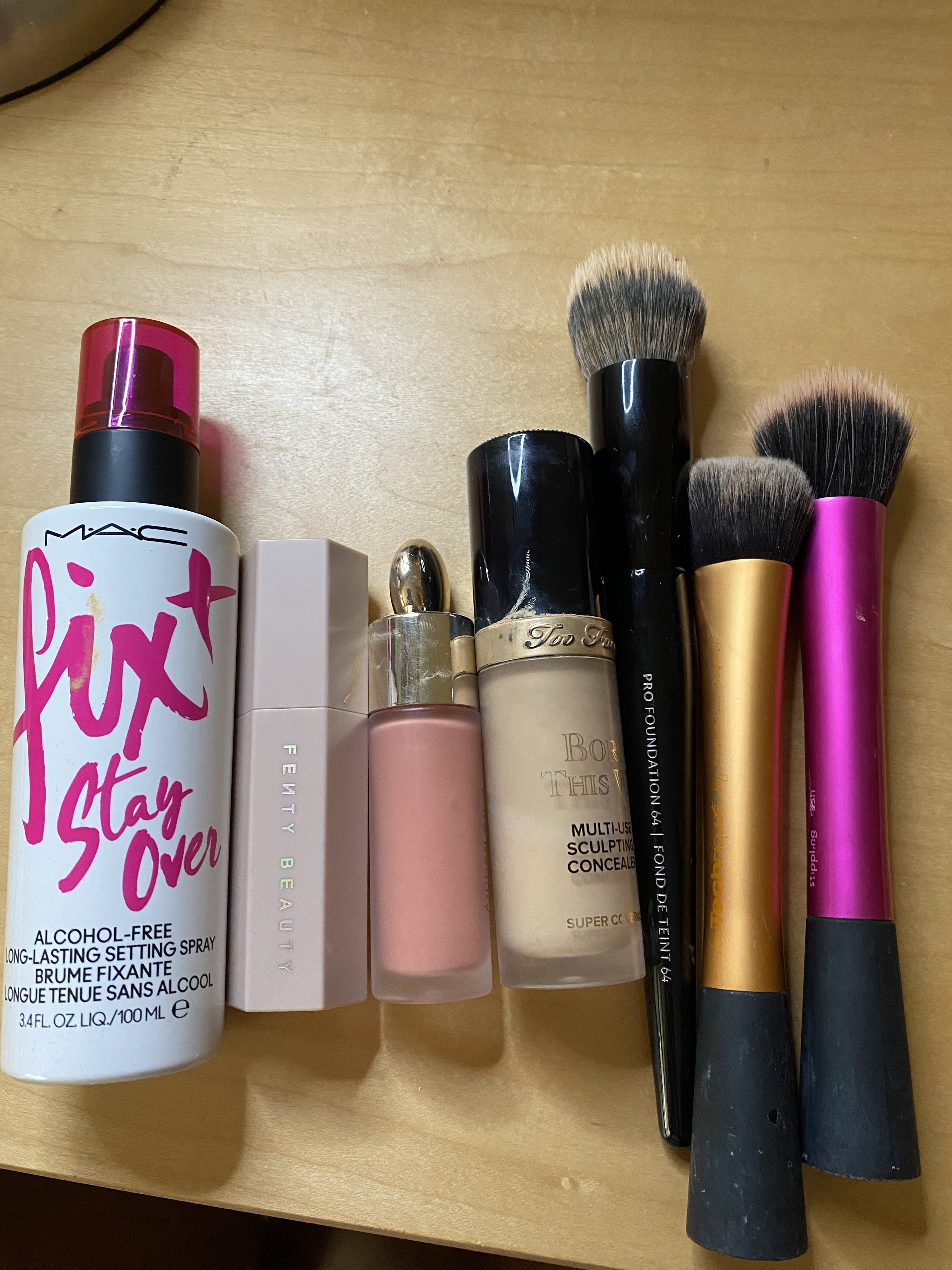 A row of makeup products on a table