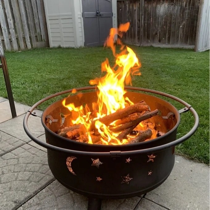 A reviewer&#x27;s outdoor fireplace with stars and moons