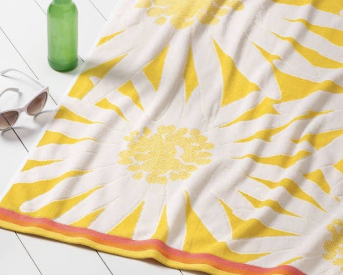 A yellow flower extra large beach towel