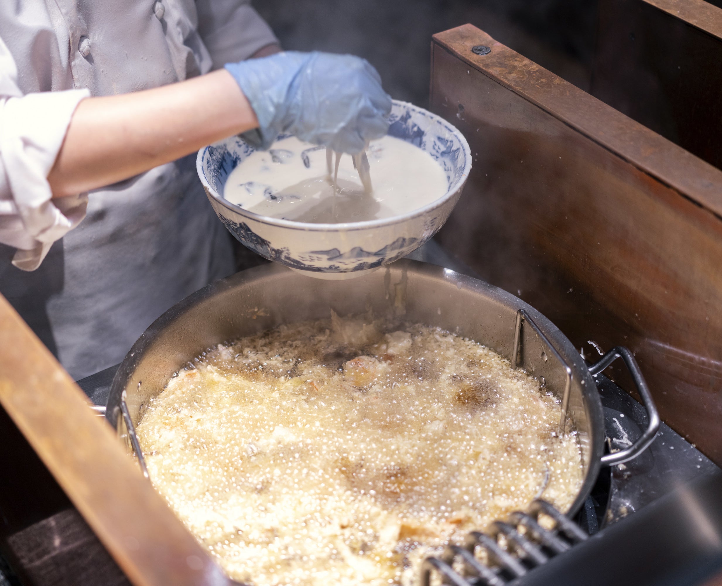 a person frying tempura