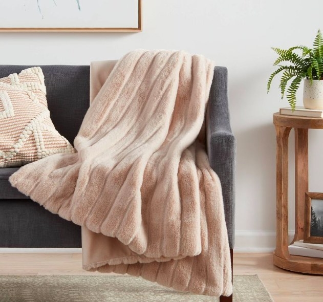 The blanket draped over a couch