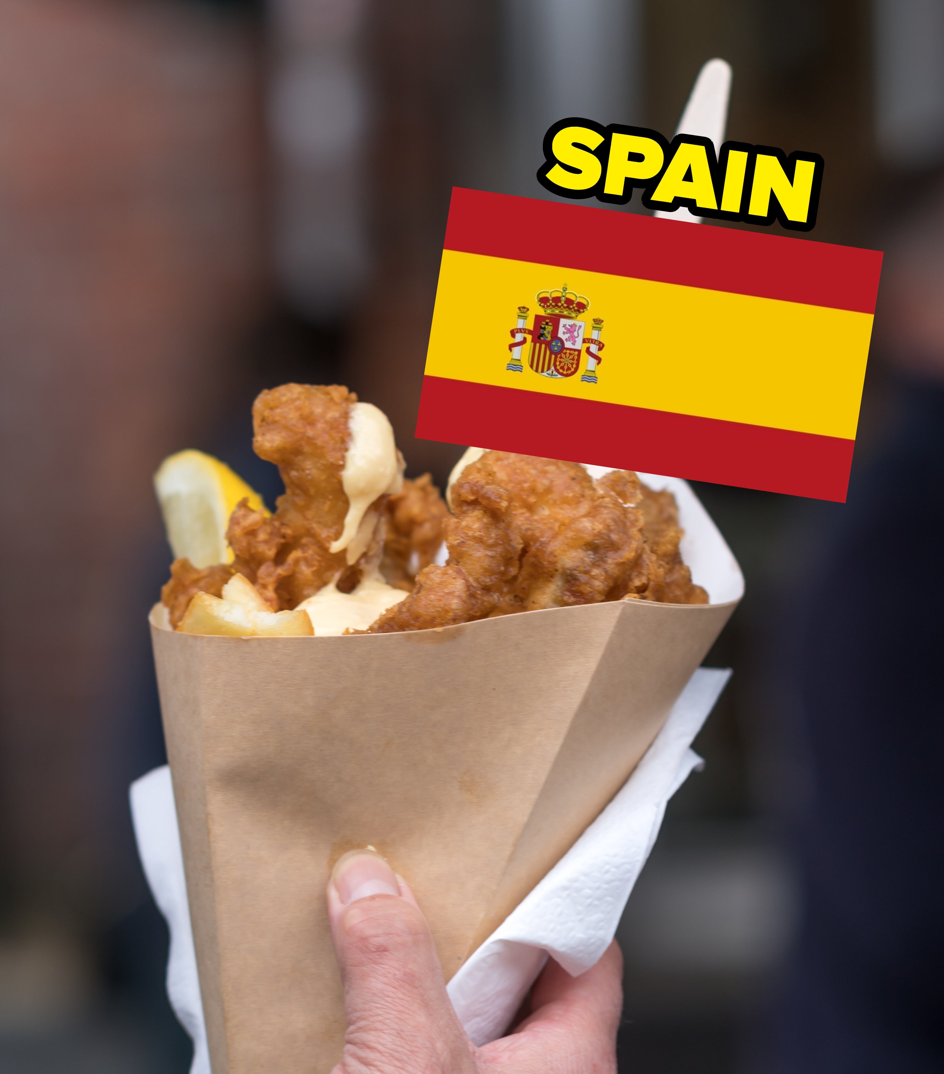 a person holding fried fish with a Spanish flag image
