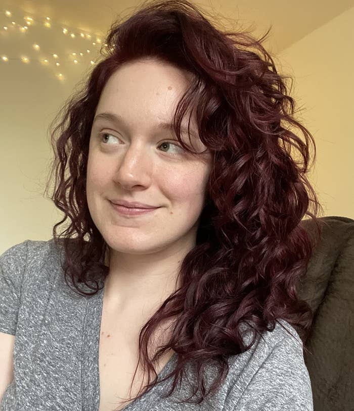 a reviewer with bouncy curls after using this hair oil