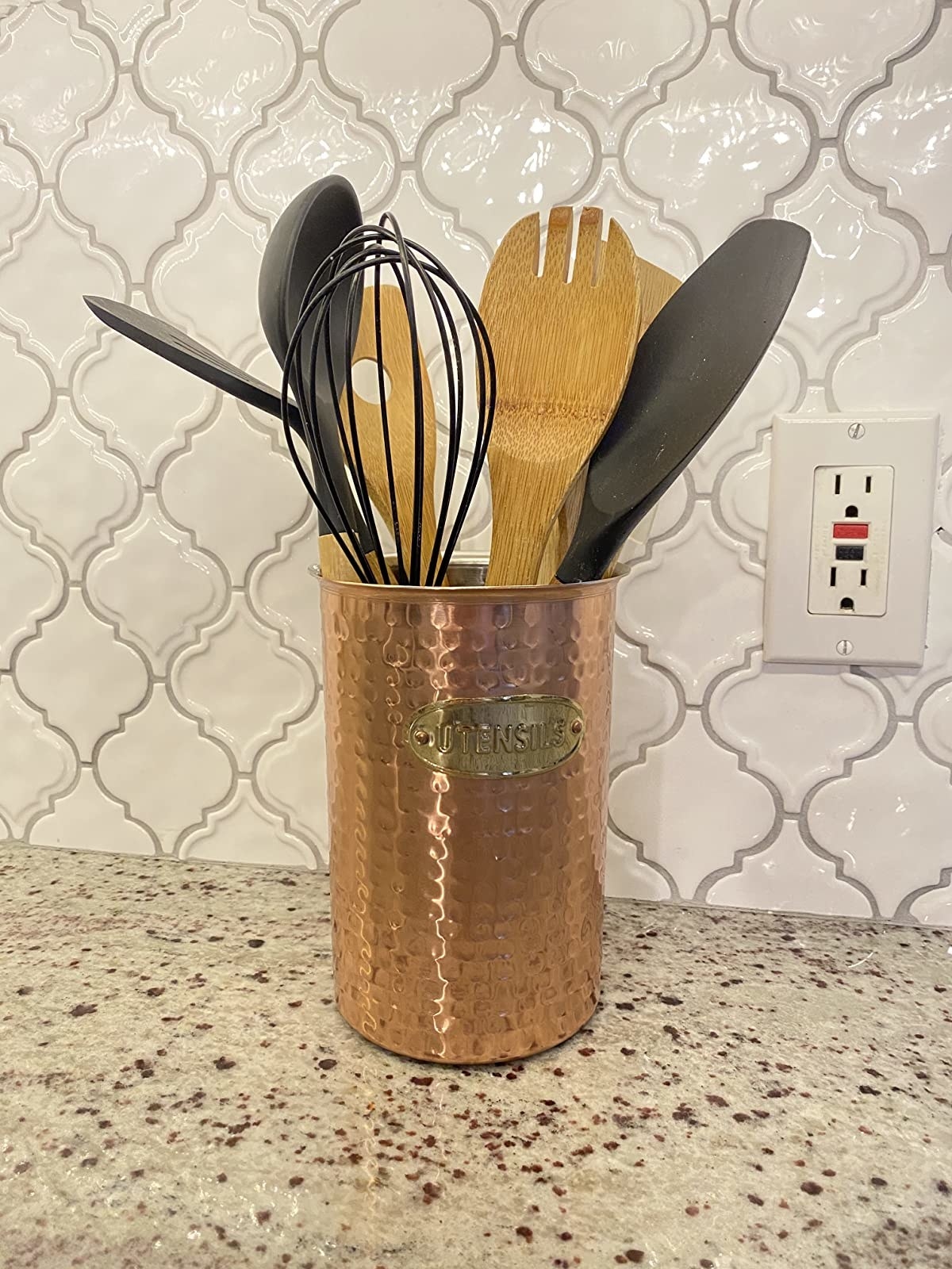 Reviewer&#x27;s copper utensil holder is shown