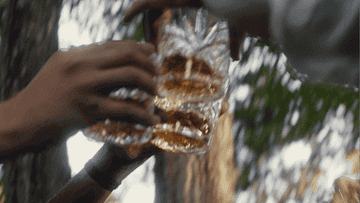 Hands of men toasting at a wedding celebration