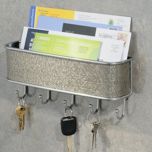a brushed silver five hook mount holding keys and letters