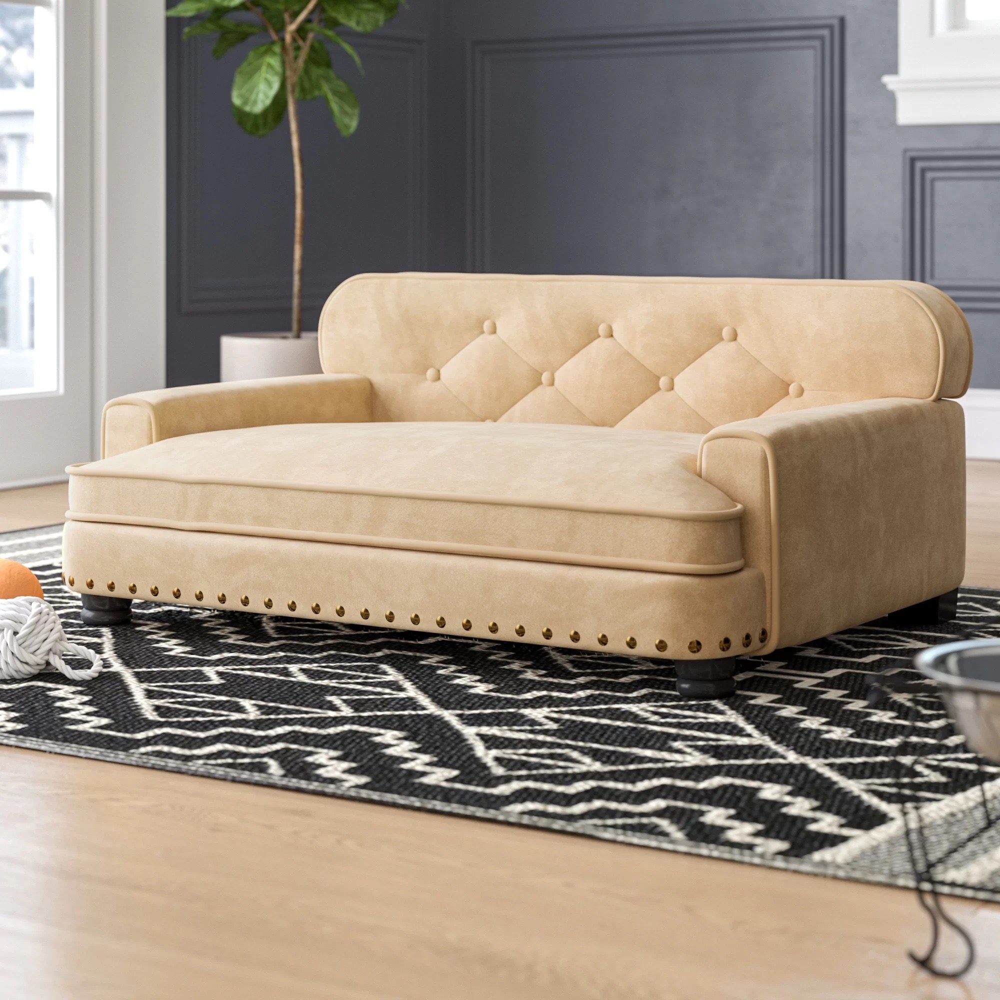 a cream colored dog sofa bed with tufted design