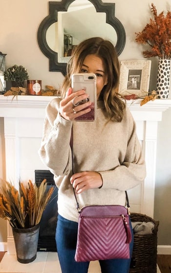 reviewer wearing the purple crossbody bag