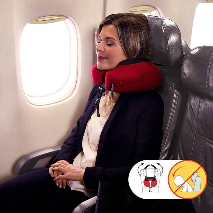 Model is resting in the travel pillow while it&#x27;s secure on their headrest