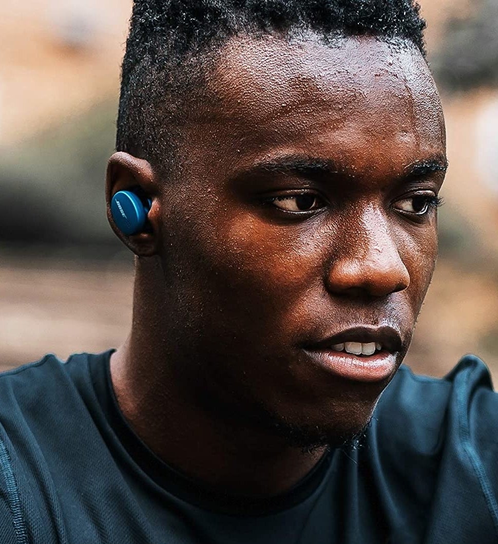 A person wearing the earbuds