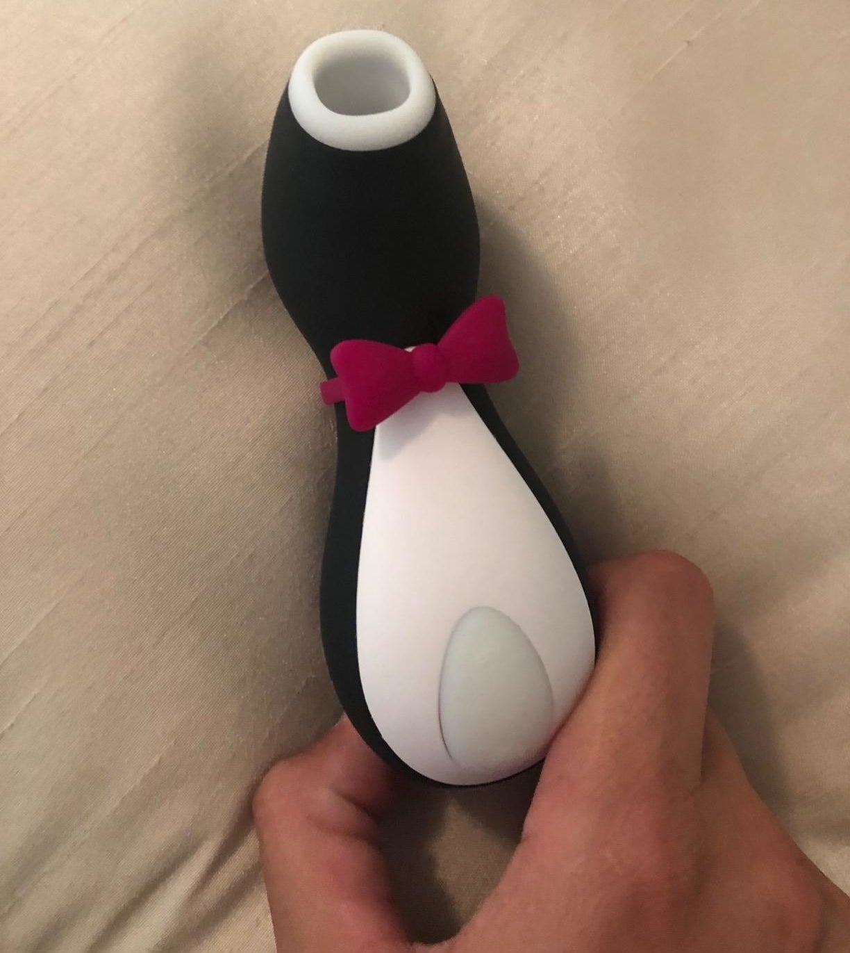 Reviewer&#x27;s photo holding the penguin vibrator