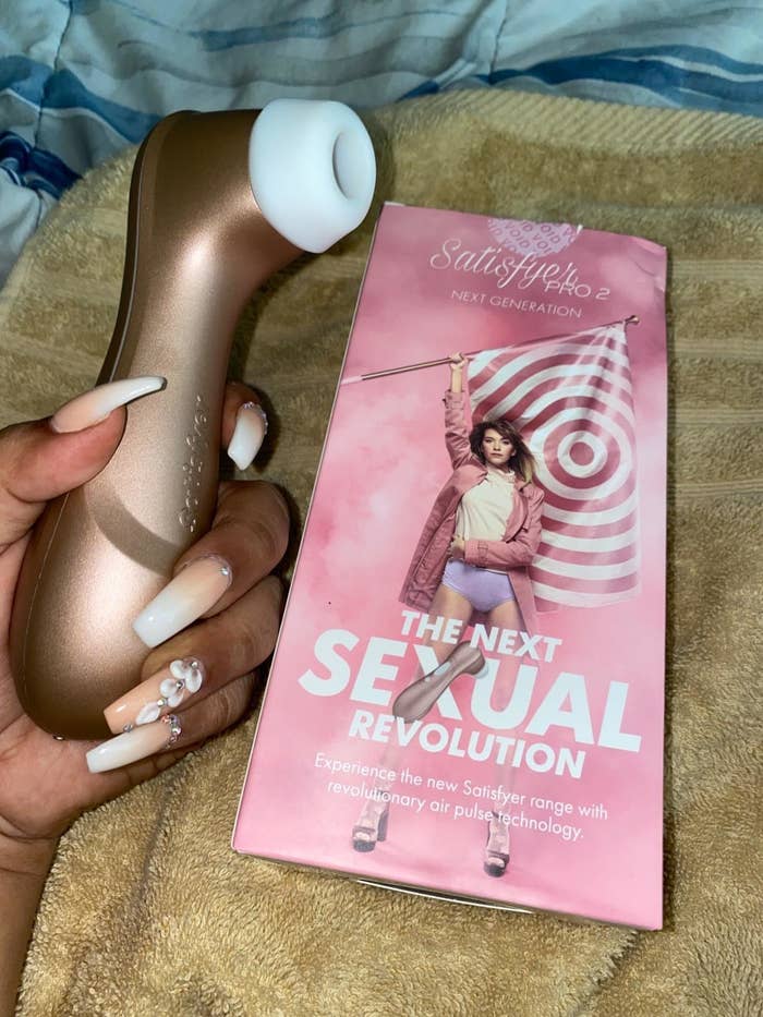 Reviewer's photo of the rose gold suction toy