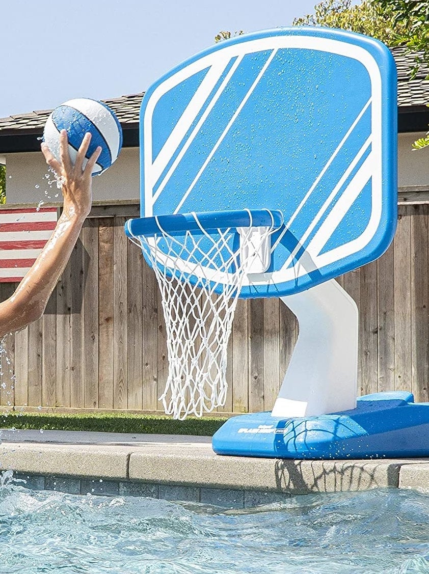 a basketball net on the side of a pool