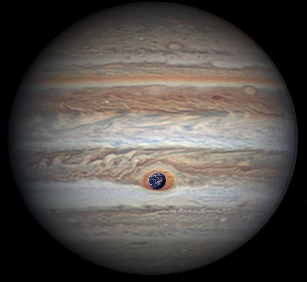 The Earth photoshopped into a spot on Jupiter, which conveys just how much smaller Earth is