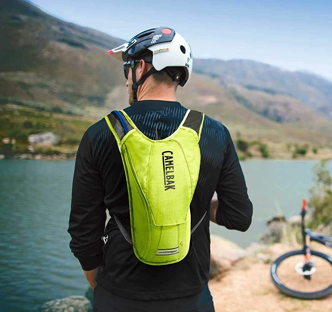 a person wearing the hydration pack outdoors