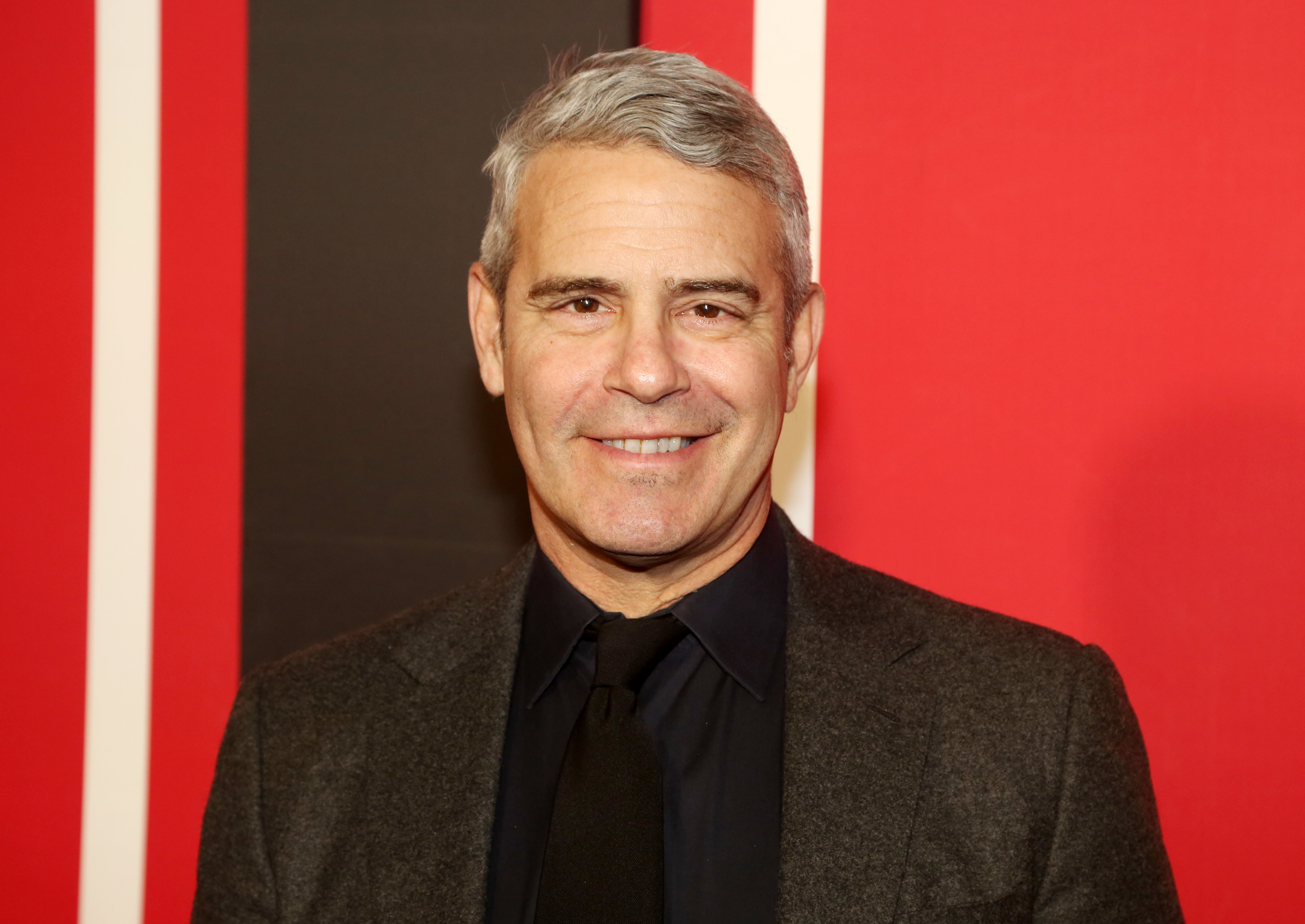 Andy Cohen smiles at the &quot;Plaza Suite&quot; opening night in March 2022