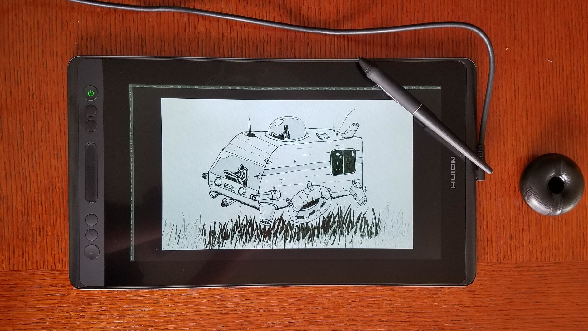 reviewer photo of a sketch on their graphics tablet and the included stylus on top of the screen
