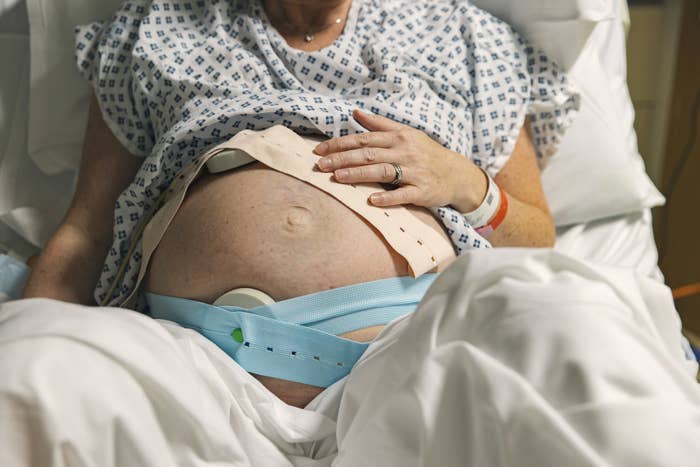 A pregnant woman in delivery room getting ready to give birth.