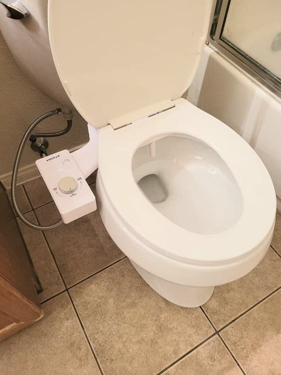 reviewer image of the bidet attachment on their toilet