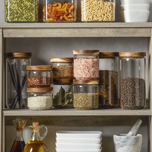 Storage jars full of ingredients in a cabinet