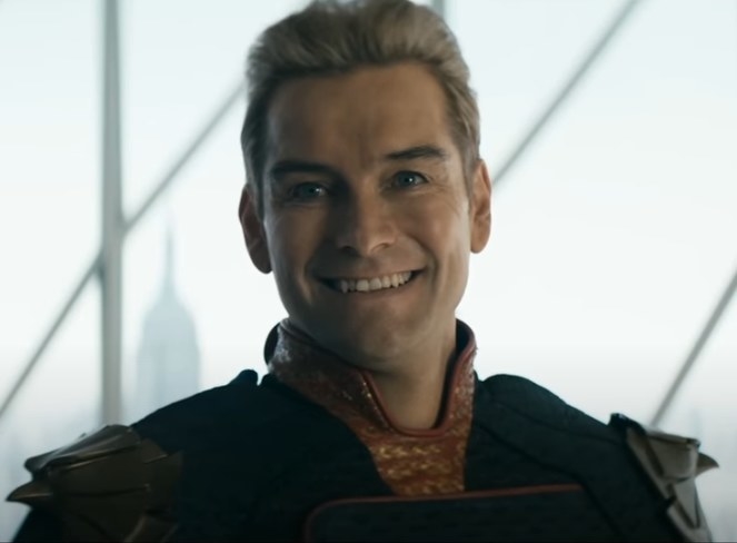 Antony Starr as Homelander smiling for a photo with a menacing look
