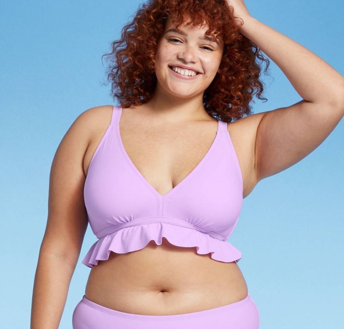 model wearing ruffled lavender bikini top